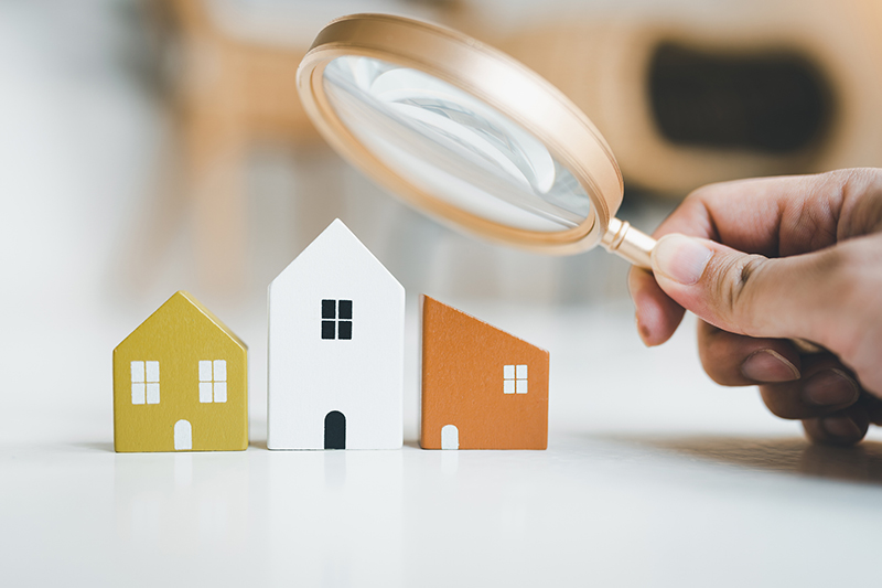 magnifying-glass-and-house-model